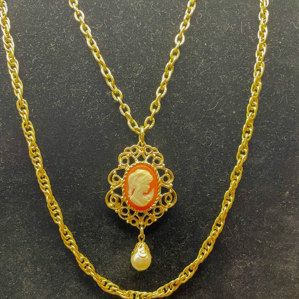 Sarah Coventry Gold Tone Cameo Necklace with Dangling Faux Pearl Drop. 54 inches